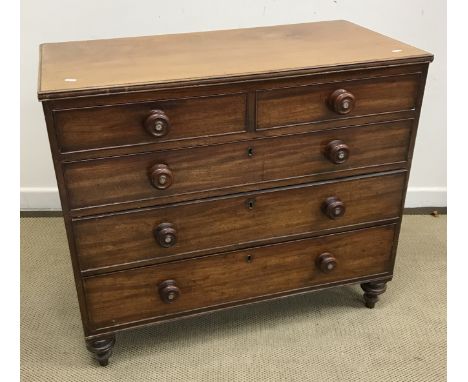 A Victorian mahogany chest of drawers, the plain top above two short and three long drawers with knob handles set with mother