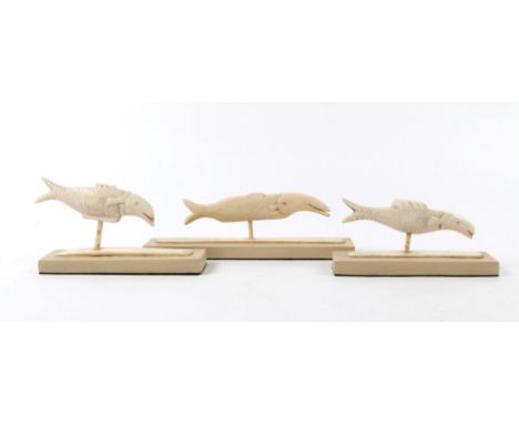 A GROUP OF THREE WHALERS CARVED BONE MODELS of whales each mounted on painted rectangular plinth, 18cm to 13cm long