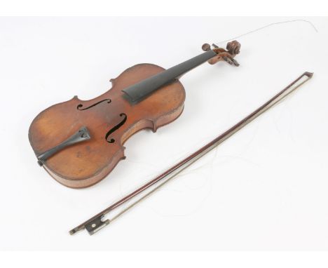A LATE 19TH CENTURY CONTINENTAL VIOLIN bearing a faux Stradivarius label, for restoration, violin back 37cm