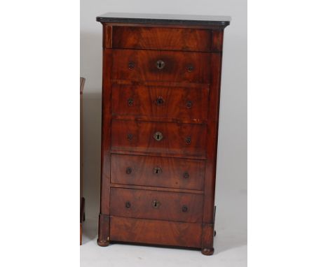 A 19th century French mahogany chest, having black marble top and a blind frieze drawer over five further long drawers, w.65c