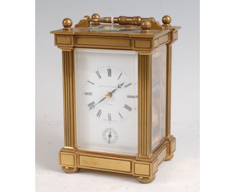 A Matthew Norman lacquered brass carriage clock with alarm, having a swing carry handle over visible platform escapement, whi