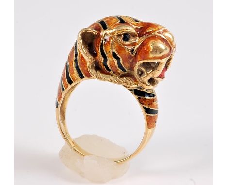 *An 18ct enamelled tiger ring, the naturalistically modelled tigers head enamelled in orange and black with red tongue, taper
