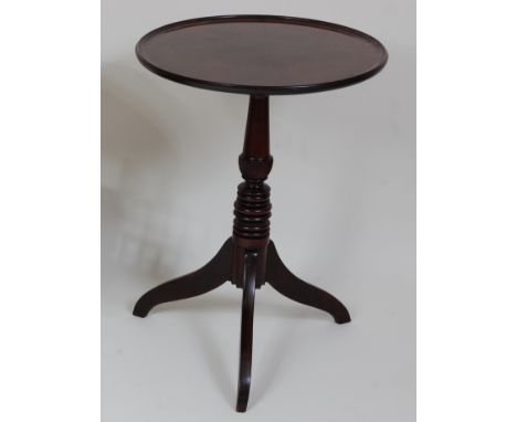 *A Regency mahogany occasional table, the circular dished top on a turned urn column to tripod base, top dia. 53cm, h.72cm