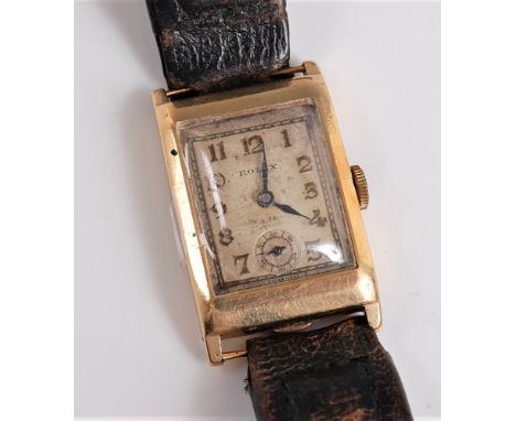 A gentleman's 1930's 9ct Rolex wristwatch, the rectangular signed face with gilt Arabic numerals, steel hands, subsidiary sec