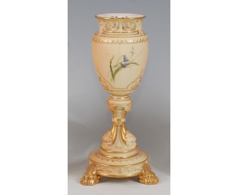 *A Royal Worcester porcelain blue ivory pedestal vase, having reticulated rim to a tapering body, raised on dolphin supports 