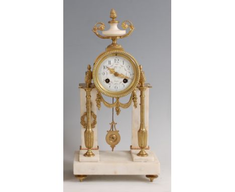 A late 19th century French marble and gilt metal portico clock, the convex white enamel dial having Arabic numerals, indistin