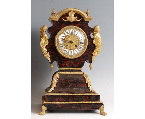 A circa 1800 French faux tortoiseshell and gilt metal mantel clock, the balloon shaped case with figural bust mounts, gilt me