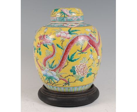 A Chinese export yellow ground ginger jar and cover, the whole enamel decorated with four-claw dragons amidst flowering plant