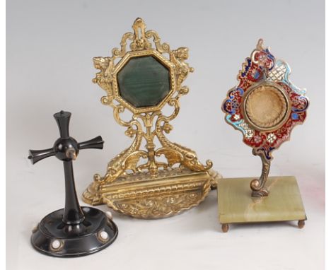 A Victorian cast brass watch holder, the back raised on stylised fish, h.16.5cm; together with a continental enamelled gilt m