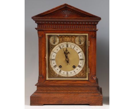 A circa 1900 German oak cased bracket clock, having square brass dial with silver chapter ring, subsidiary chime/silent and r