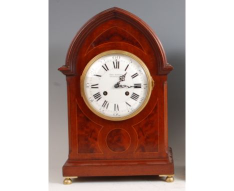 A circa 1900 mahogany and inlaid bracket clock, having a lancet top, the convex white enamelled dial signed Paul Garnier, hav