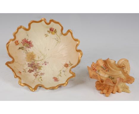 *A Royal Worcester porcelain blush ivory lotus leaf bowl, having a gilt edge, painted with floral sprays, having puce mark ve