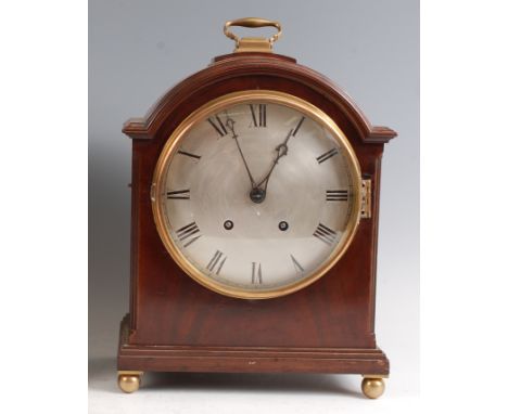 An Edwardian mahogany dome-top mantel clock, having an unsigned silvered convex dial, twin winding holes for a brass eight da