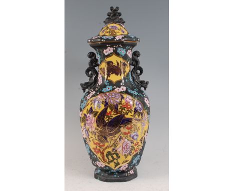 A Mason's Patent Ironstone vase and cover, enamel decorated in the Oriental palette with reserves of exotic birds amidst flow