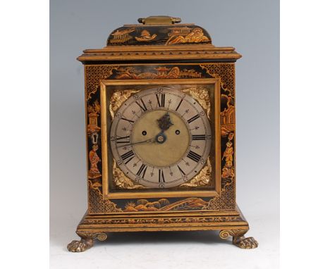A late 19th century chinoiserie black lacquered bracket clock, having brass swing carry handle, the brass dial with cherub ma
