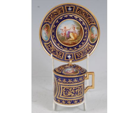 *A 19th century Vienna porcelain chocolate cup and cover on stand, hand-painted with classical scenes on a cobalt blue ground