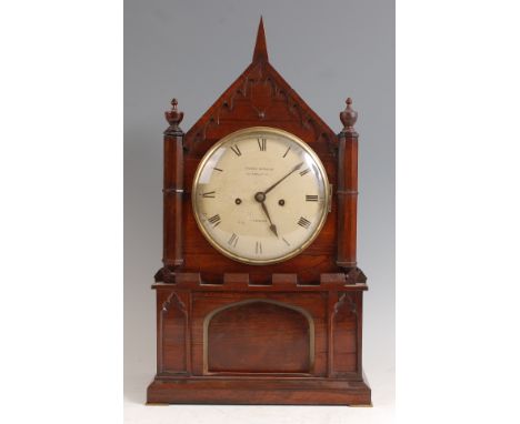 An early Victorian rosewood cased bracket clock, having Gothic influenced case, convex white enamelled dial signed Francis Ha