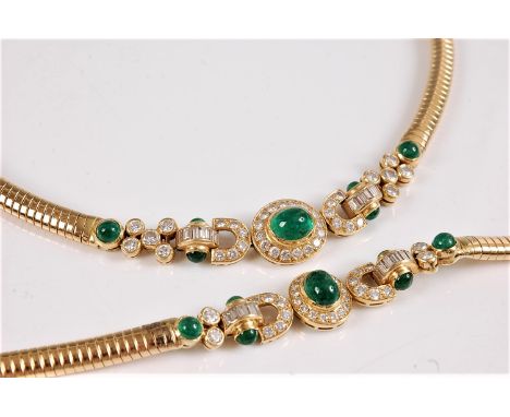 An 18ct emerald and diamond necklace and matching bracelet, the central oval emerald cabochon, collet mounted and surrounded 