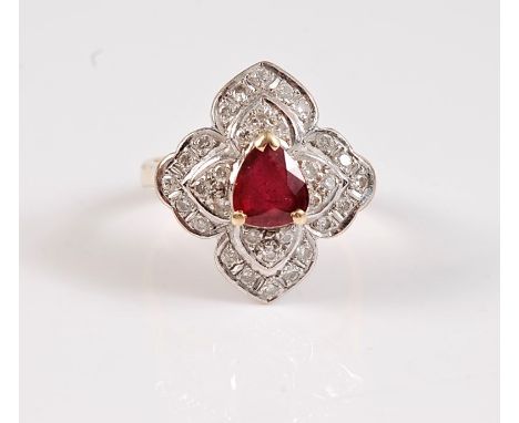 An 18ct ruby and diamond ring, the central trilliant cut ruby surrounded by four two tier diamond set petals, total estimated