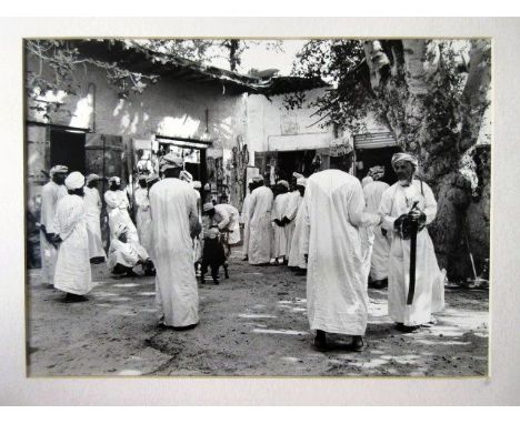 An interesting framed and mounted middle-Eastern interest photographic Print, depicting a busy Souk, approx 12” x 16”.