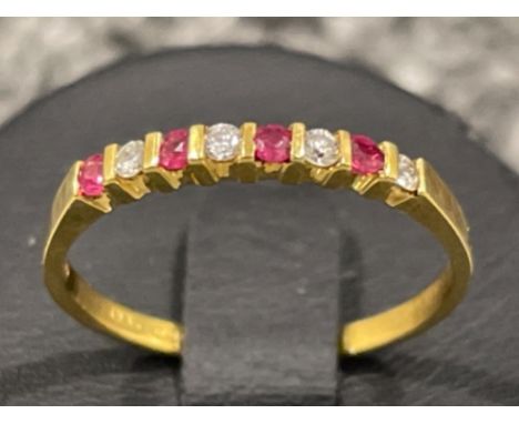 Ladies 18ct gold Ruby and Diamond stone band. Size M 1.5G