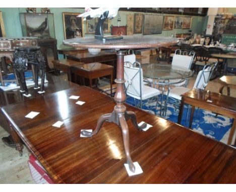 A circular tilt-top mahogany tripod table, 65cm diameter.