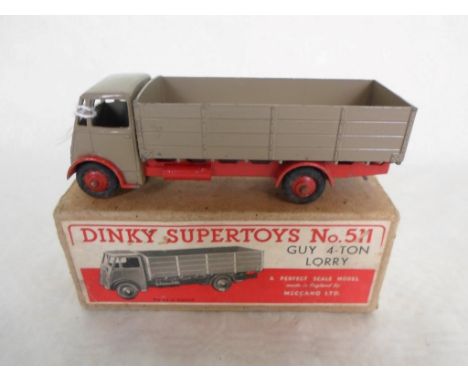A mid-20th century Dinky Supertoys Guy 4 Tonne Lorry, no. 511, the light brown cab and trailer on red chassis, in original bo
