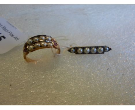 A Victorian 15ct gold, ruby and split pearl half-hoop ring, with two bands of split pearls between trefoil ruby shoulders, to