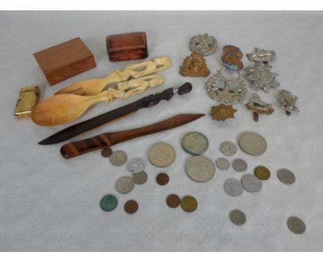 An interesting collector's lot to include: military uniform badges, a Dunhill 70 cigarette lighter, assorted coins, wooden ca
