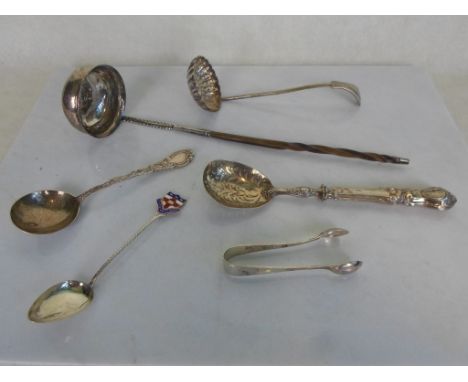 A horn handled white metal toddy ladle, inset with a George III thrupence, together with a silver silver sifter spoon and fou