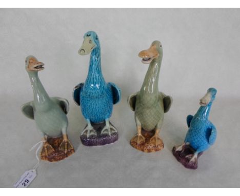 A collection of four early 20th century Chinese ceramic ducks, each decorated in polychrome enamel, the tallest 21cm.