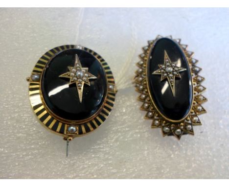 A Victorian black enamel and seed pearl mourning brooch, with glazed panel to reverse, together with another similar.