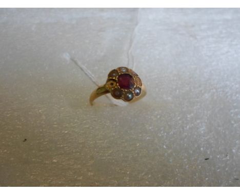An 18ct gold ruby and seed pearl ring.