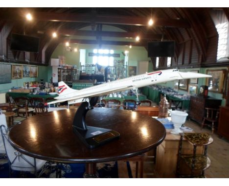 A Bravo Delta scale model of British Airways Concorde, mounted to display stand with date 1969 - 2003, 62cm.   Condition Repo