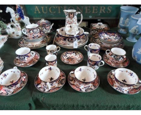 A large quantity of 19th century and later Royal Crown Derby Imari pattern teawares, to include examples with Bloor backstamp