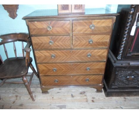A mahogany chest, having four short over three long drawers on bracket feet, 93cm wide.