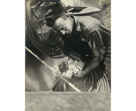 Lerski, Helmar -- Fisherman. 1930-1944. Vintage warm-toned gelatin silver print. 29,5 x 23 cm. Signed by the photographer in 