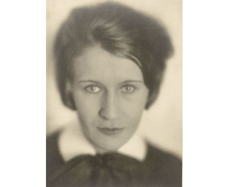 Jacobi, Lotte -- Portrait of a young woman. 1930s. Vintage gelatin silver print. 24 x 18 cm. Mounted to board (slight traces 