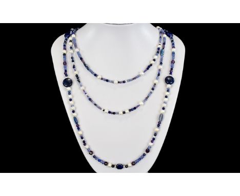 A Handmade Cultured Freshwater Pearl, Blue Agate And Blue Tigers Eye Long Necklace Handmade in England this necklace comprise