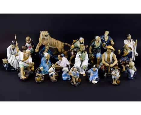 A Collection of Oriental Ceramic Decorative Figures (20) in total. Various sizes and poses. Together with a roaring tiger sta