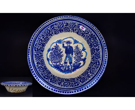 Spanish/Portuguese Large Faience Bowl, the hand rendered decoration, in blue and white, comprising a gentleman in cropped jac