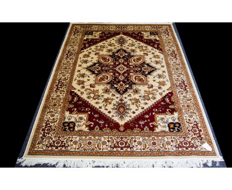 A Large Woven Silk Carpet Keshan rug with beige ground and traditional Middle Eastern floral and foliate border detail with c