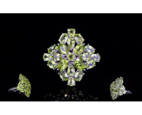 Ladies Silver And Changbal Peridot Ring Statement ring set with 23 faceted Changbal Peridot, the total equating 12.3ct. The w