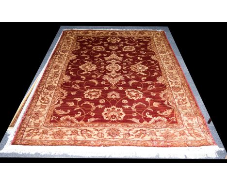 A Very Large Woven Silk Carpet Large Zeigler carpet, red ground with repeated red floral and foliate design and matching red 