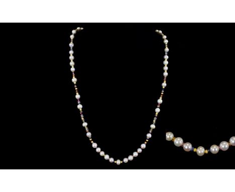 A Handmade Cultured Freshwater Pearl And Sapphire Necklace Handmade in England this necklace comprises cultured freshwater pe