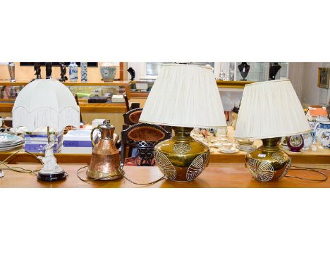 A Pair Of Ornamental Brass Lamps Squat, spherical lamps in brass with impressed floral oriental pattern and cream pintuck sha