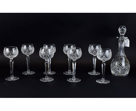 Cut Crystal Glass Decanter with star cut base 12 inches in height together with 6 crystal hock glasses also with star cut bas