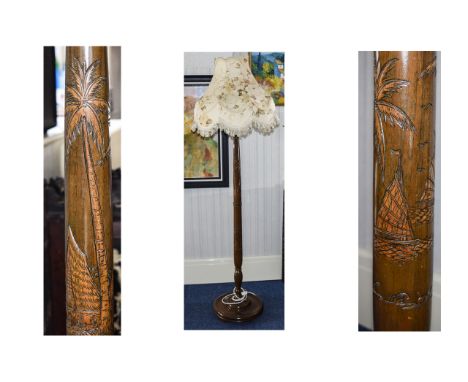 Mahogany Standard Lamp. A tall standard lamp with mahogany stand with palm tree decoration and a  cream floral shade with fri