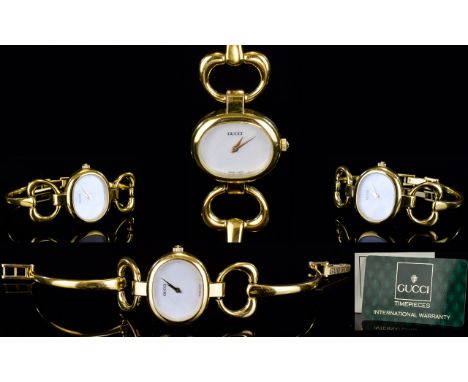 Gucci - Ladies Quartz Delux Gold Plated Cocktail Bangle Watch From The 1990's. Model No 1600, Serial No 0025119. Bought 22.7.