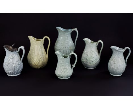 Collection of Six Floral Theme Moulded Jugs, one, Cork, Edge and Malkin; date lozenge for 1861, a Cork and Edge,showing hibis